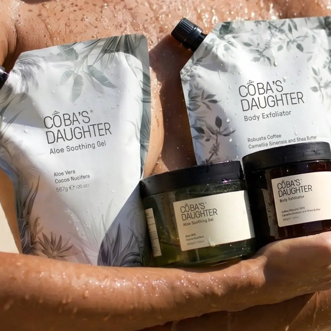 CoBa's Daughter Aloe Soothing Gel and Body Exfoliator in refill pouches and jars, held against sun-kissed wet skin
