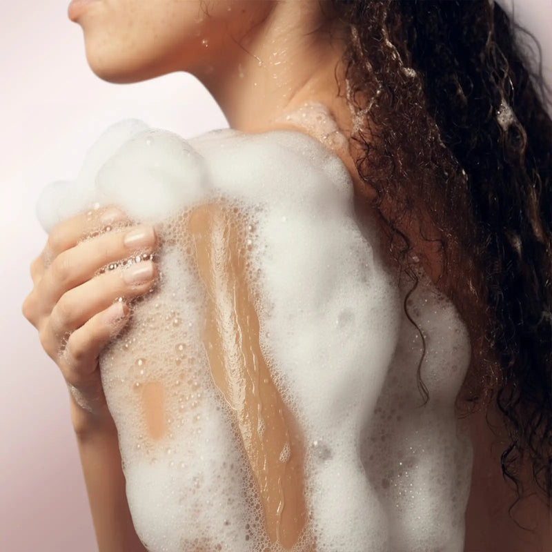 Using CoBa's Daughter 3in1 Body Wash in shower creating rich velvety lather for gentle cleansing
