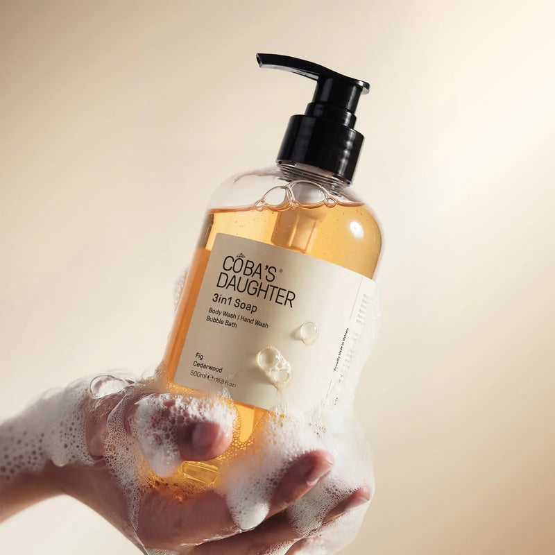 Lathering CoBa's Daughter 3in1 Fig Cedarwood Soap in hands with rich foam for body wash bubble bath and hand wash