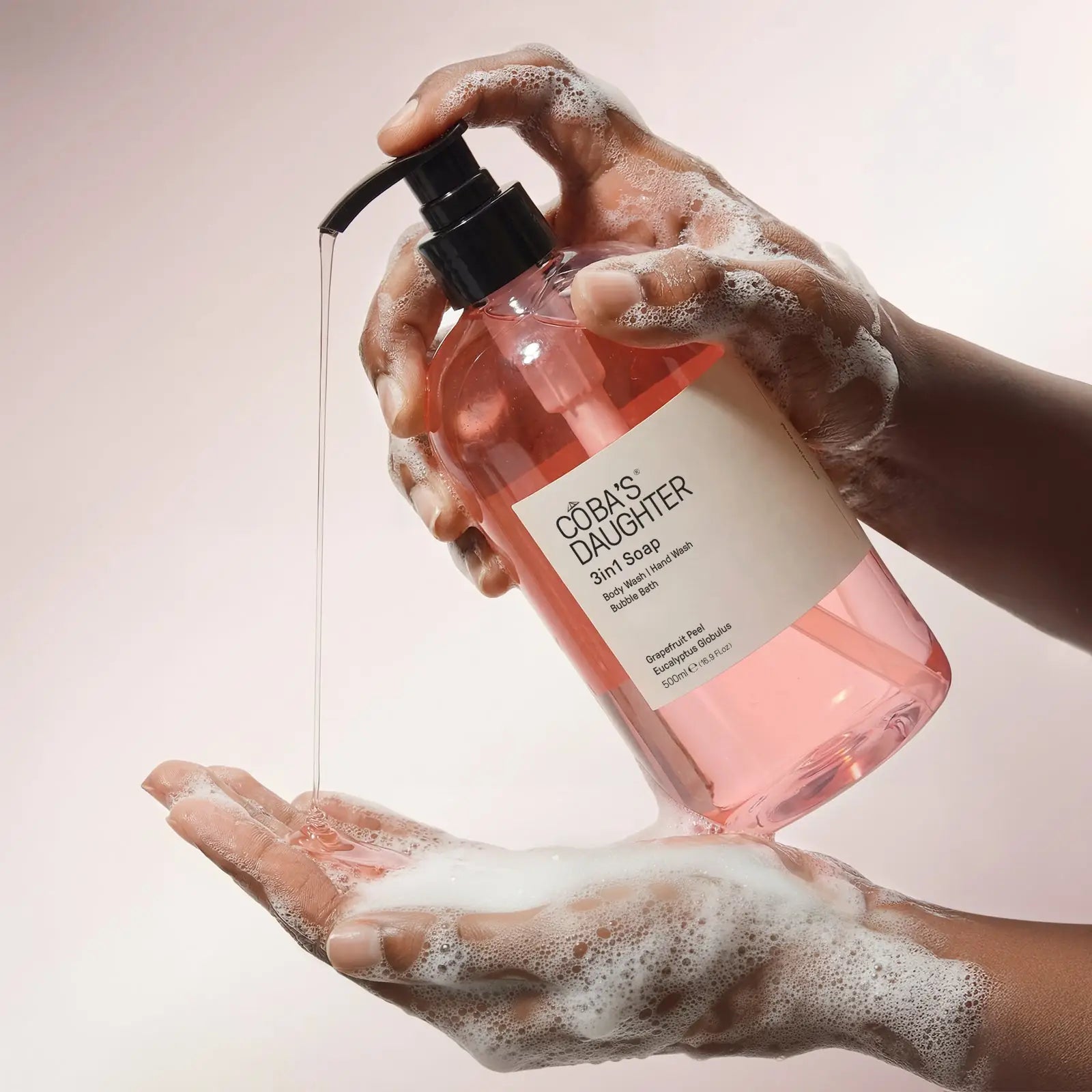 Dispensing CoBa's Daughter 3in1 Grapefruit Peel and Eucalyptus Body Wash into sudsy hands for rich velvety lather