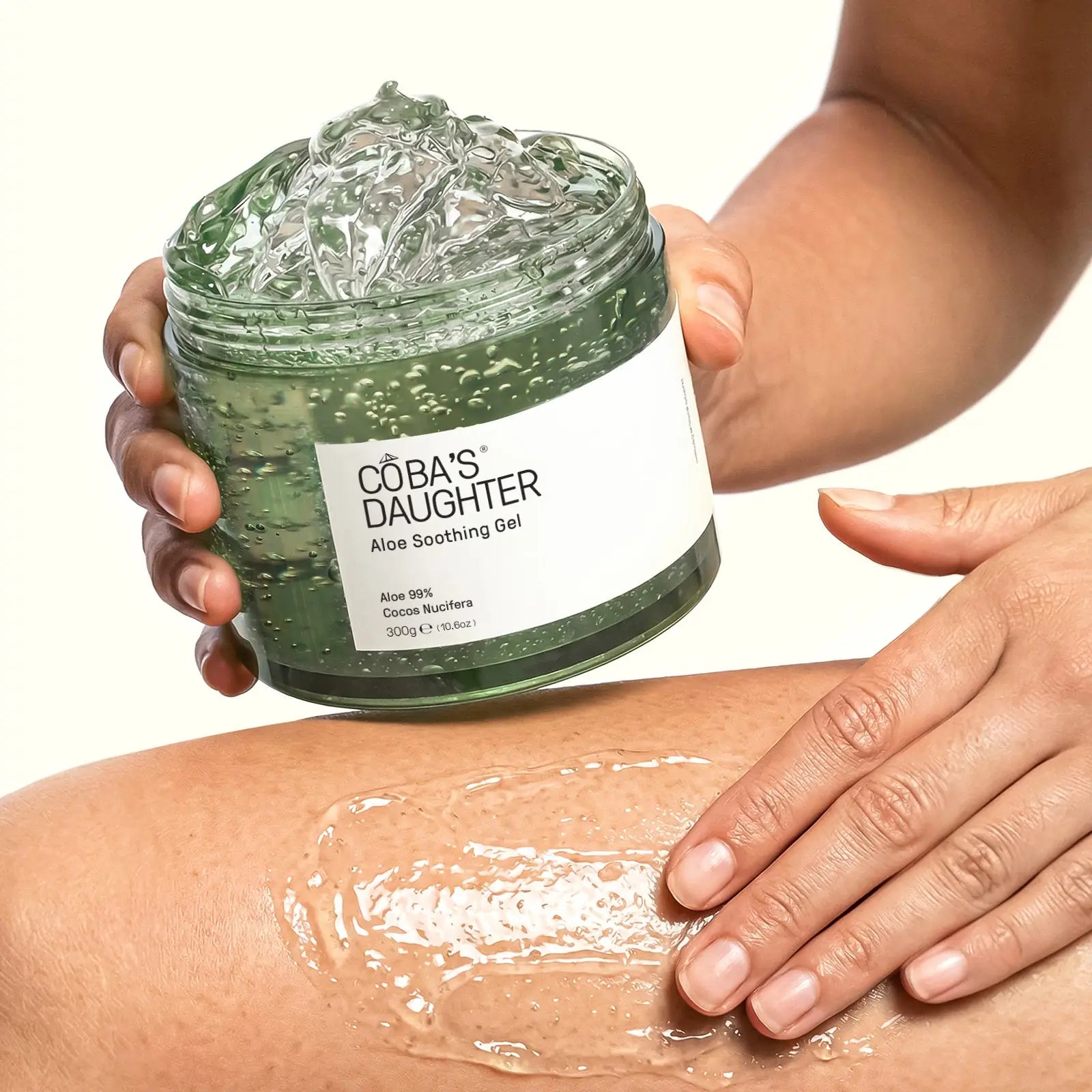 Applying CoBa's Daughter 99% Pure Aloe Soothing Gel on leg for deep hydration and soothing relief