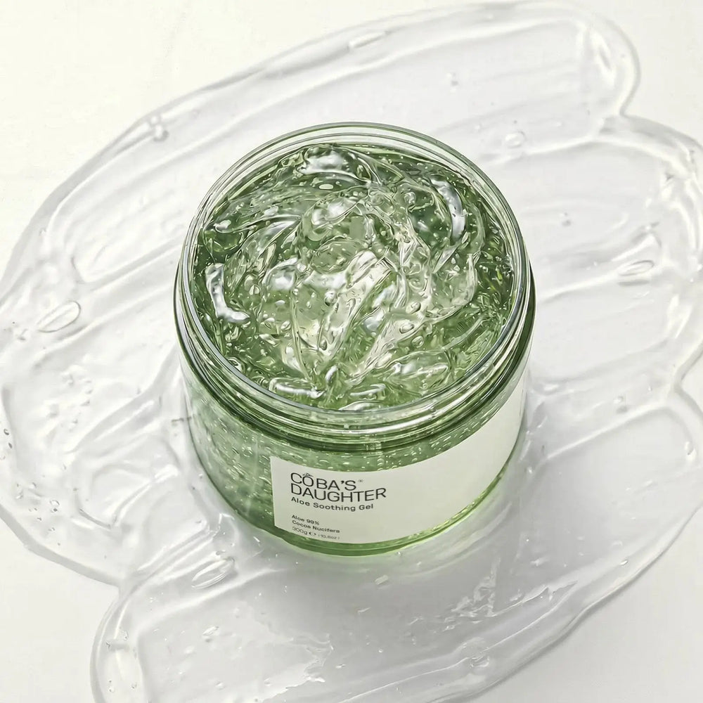 CoBa's Daughter 99% Pure Aloe Soothing Gel open jar close-up showing clear translucent texture in open jar with coconut oil and vitamin E