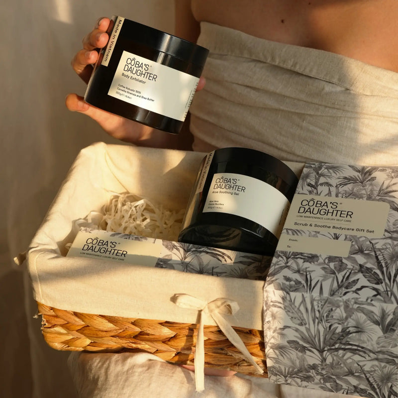 A woman holding a jar of 'CoBa's Daughter' products in a sunlit, serene background